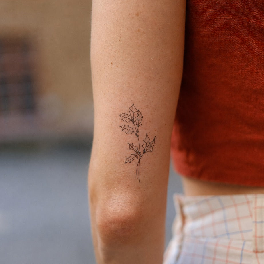 December Holly Kiss Tattoo