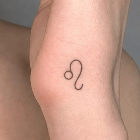 Leo Golden Glow Tattoo